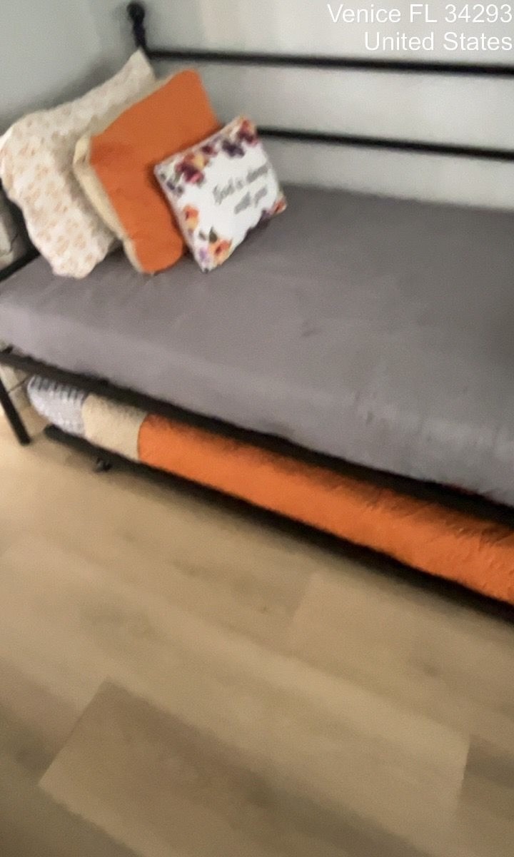Clean living room with a grey sofa after cleaning